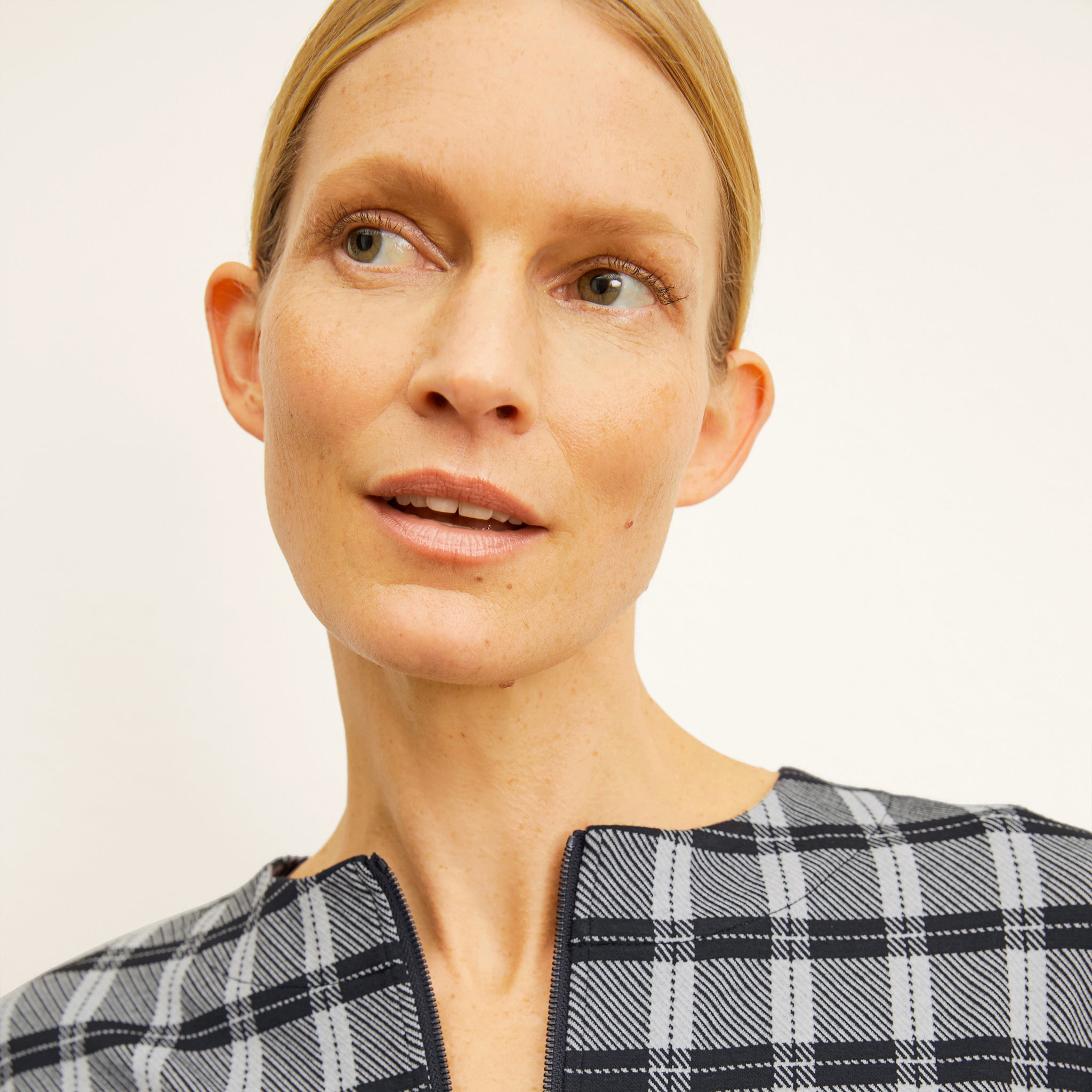 front image of a woman wearing the tully top in checkmate
