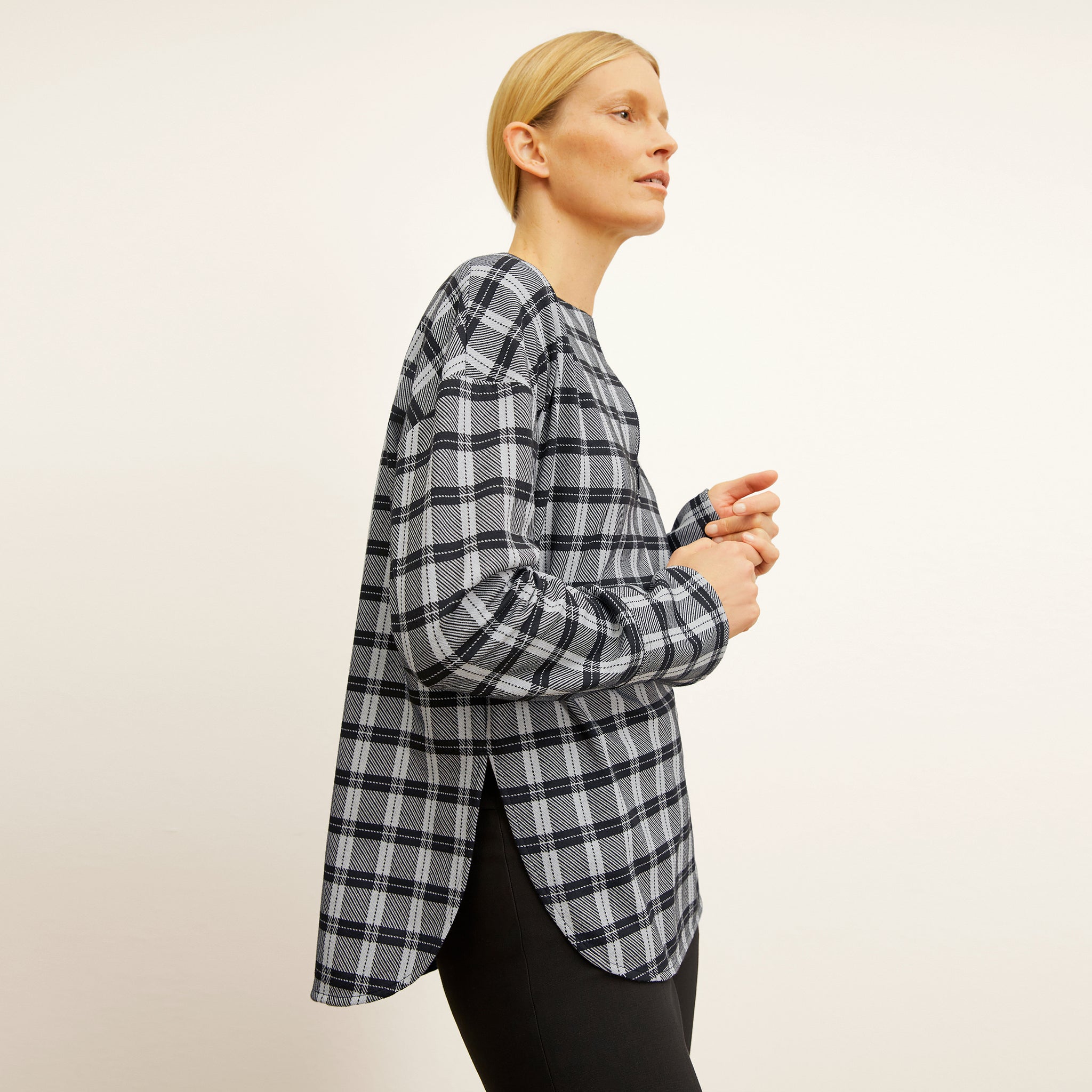 side image of a woman wearing the tully top in checkmate