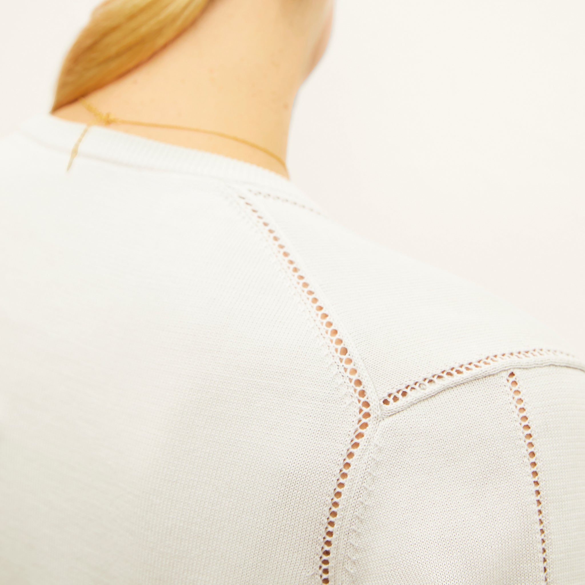 detail image of a woman wearing the mel cardigan in ivory