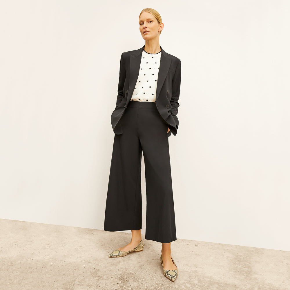 front image of a woman wearing the patty top in dot knit