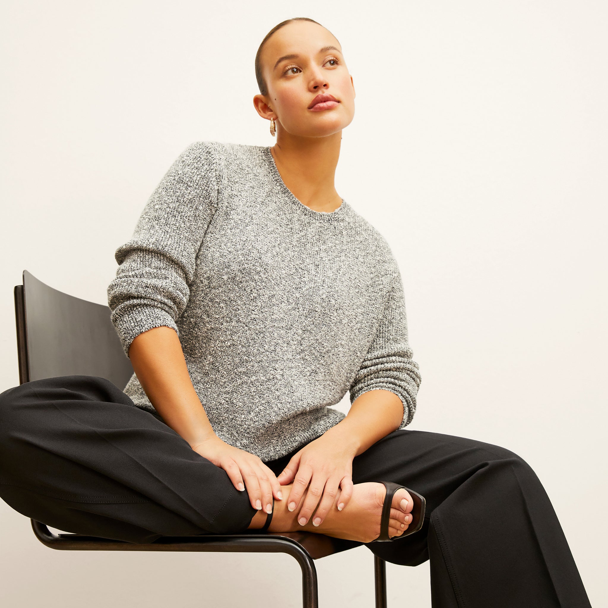 front image of a woman wearing the butler sweater in boucle knit