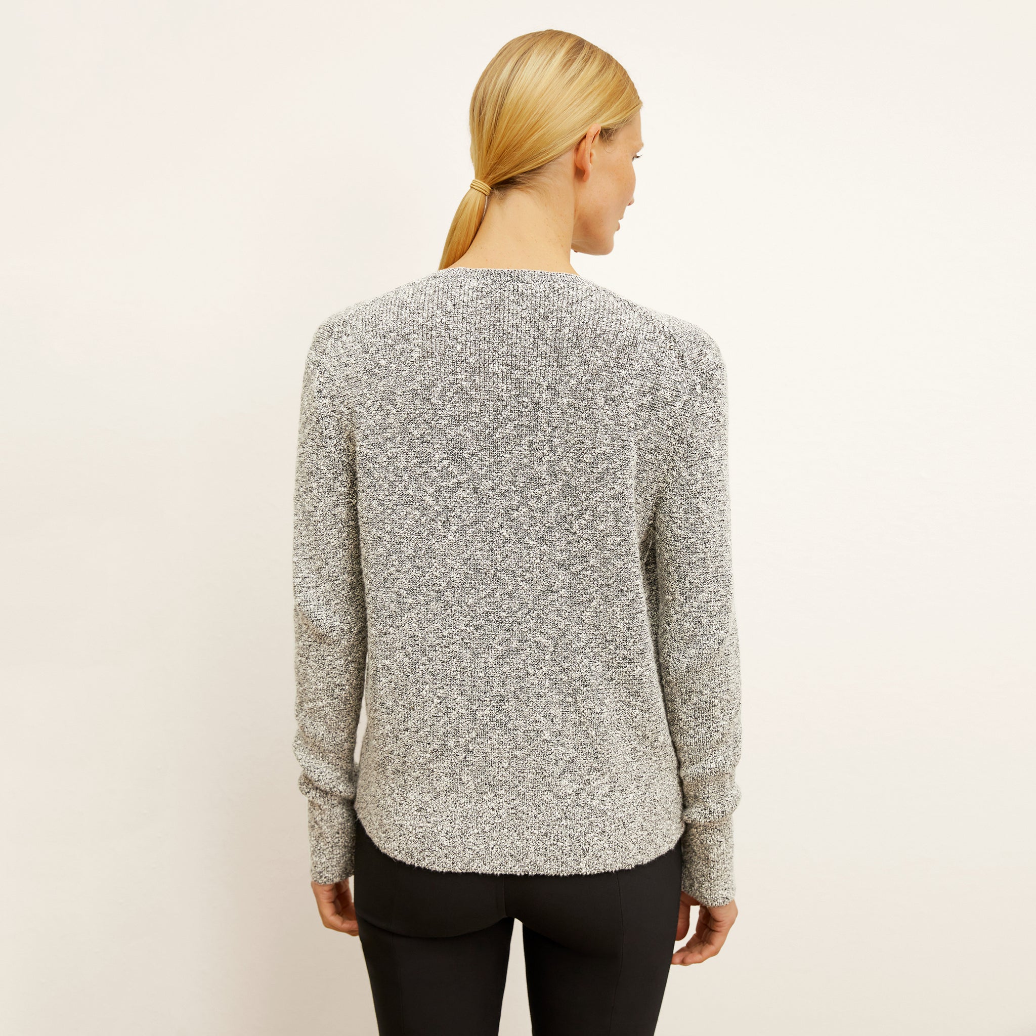 back image of a woman wearing the butler sweater in boucle knit