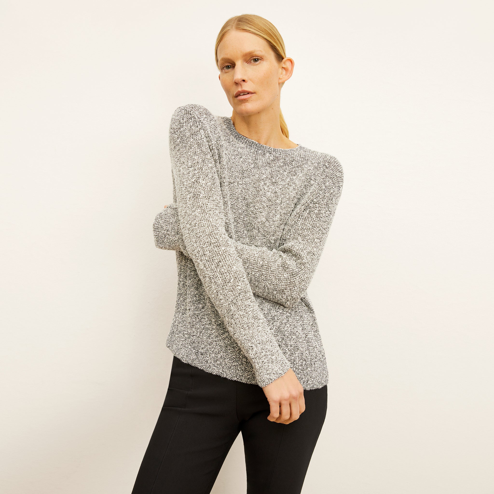 front image of a woman wearing the butler sweater in boucle knit 
