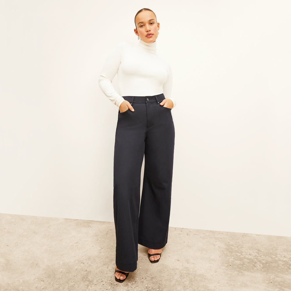 Front image of a woman standing wearing the Milo Jean in ink