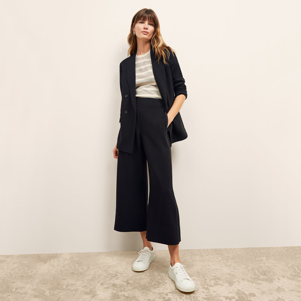 front image of a woman wearing the leslie t-shirt in signature stripe