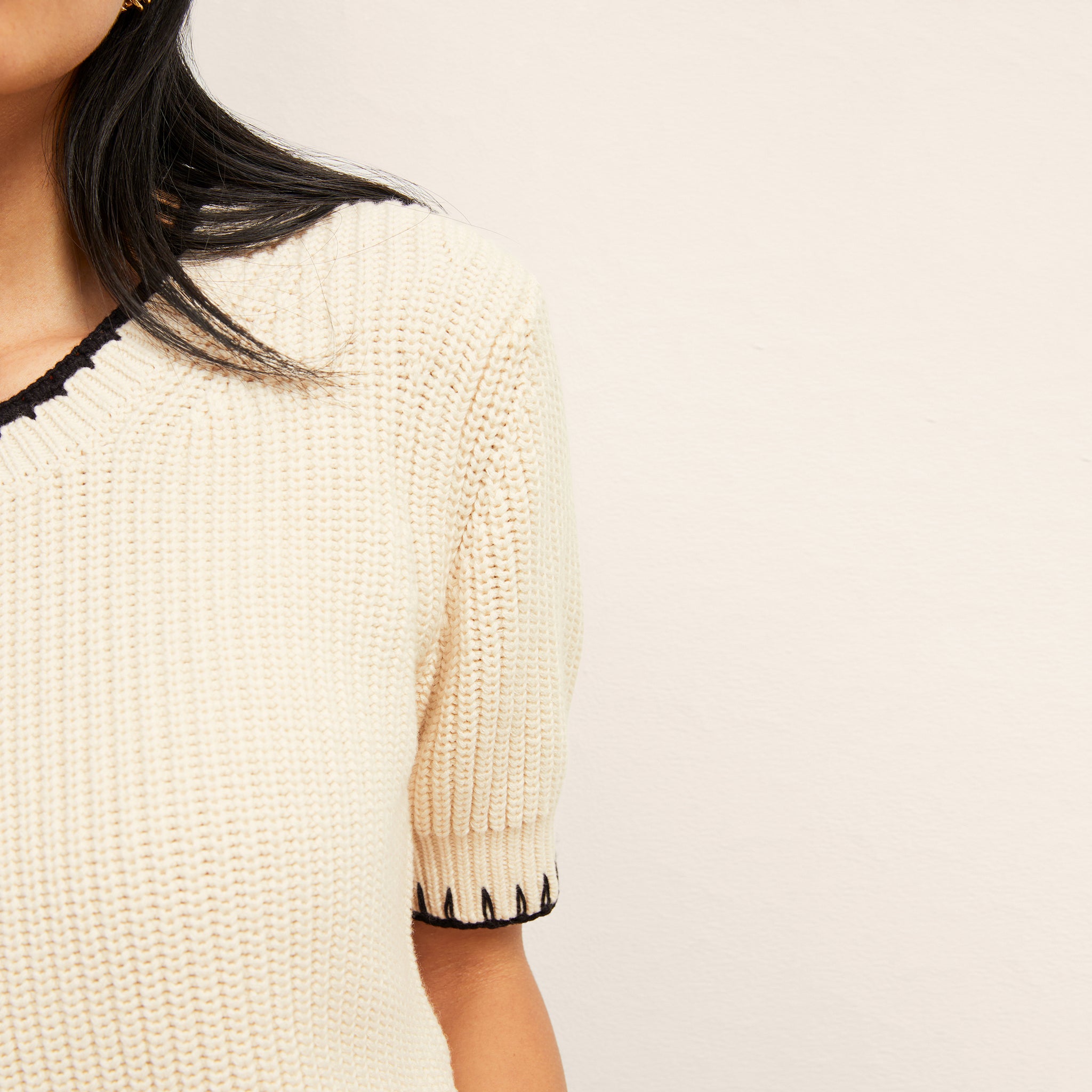 front image of a woman wearing the hallie top in contrast knit