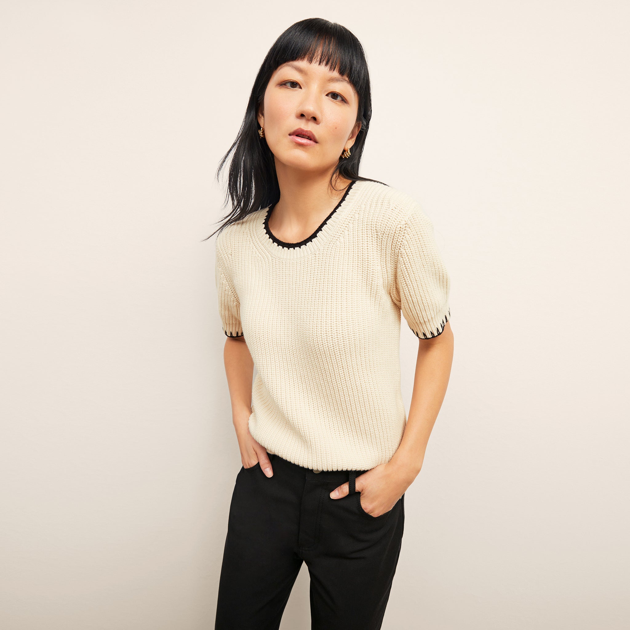 front image of a woman wearing the hallie top in contrast knit 