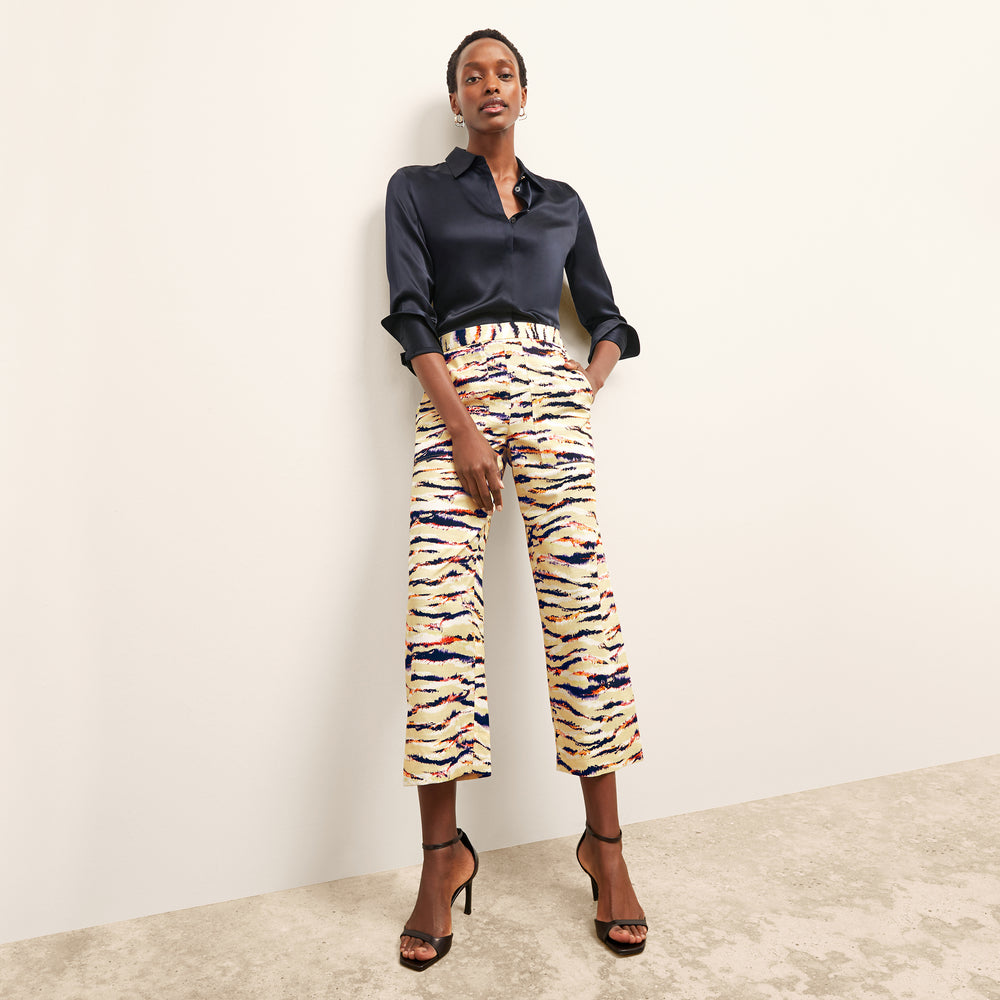 front image of a woman wearing the madelyn pant in savannah print