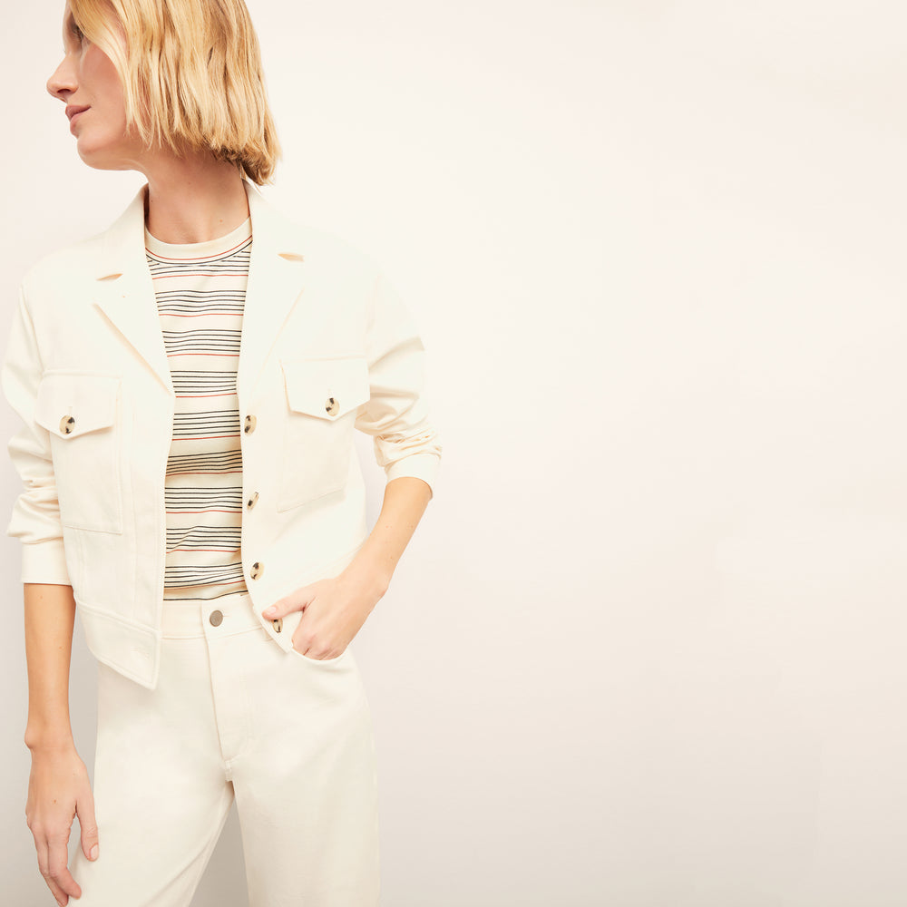 front image of a woman wearing the leslie t-shirt in signature stripe