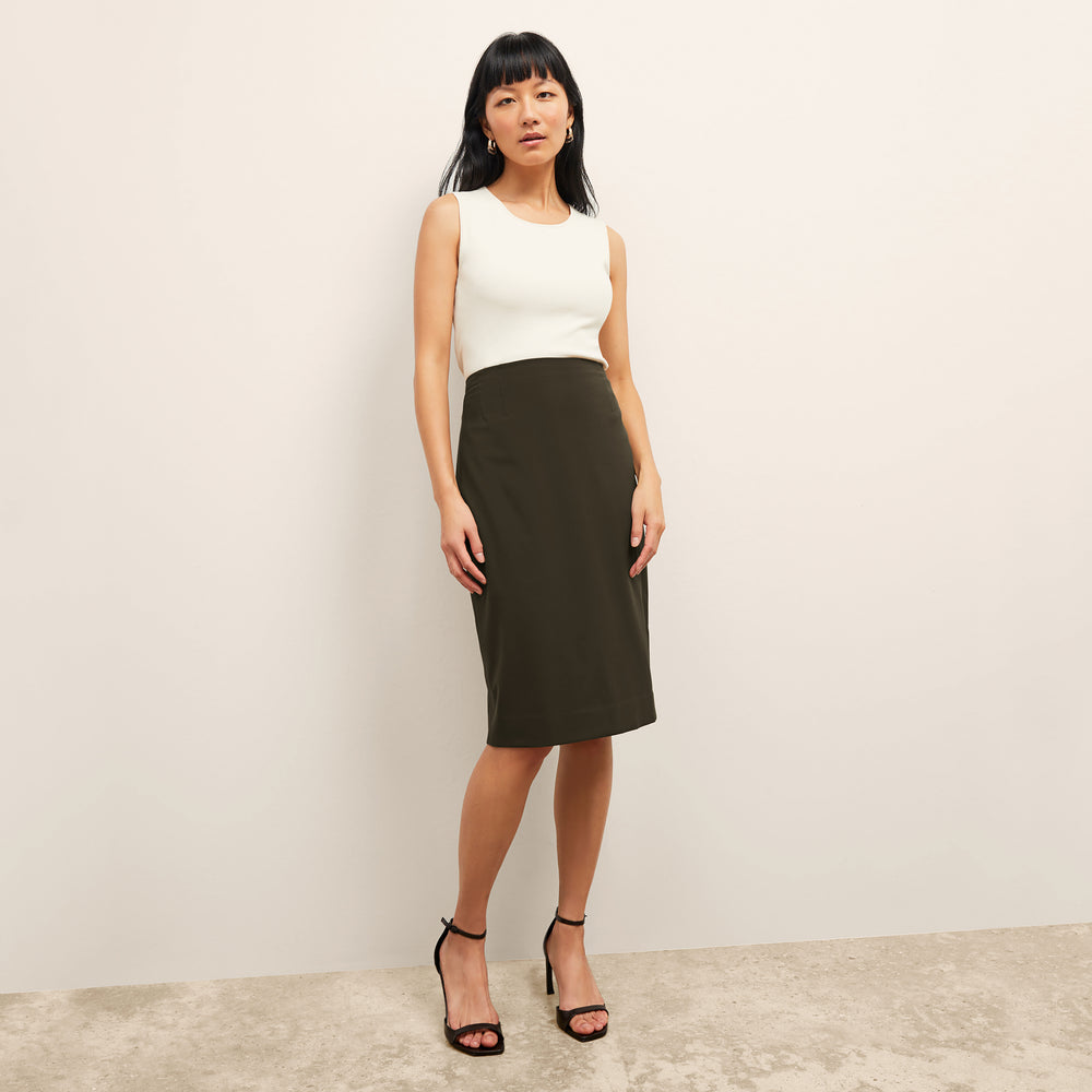 Front image of a woman standing wearing the cobble hill packable suiting in olive