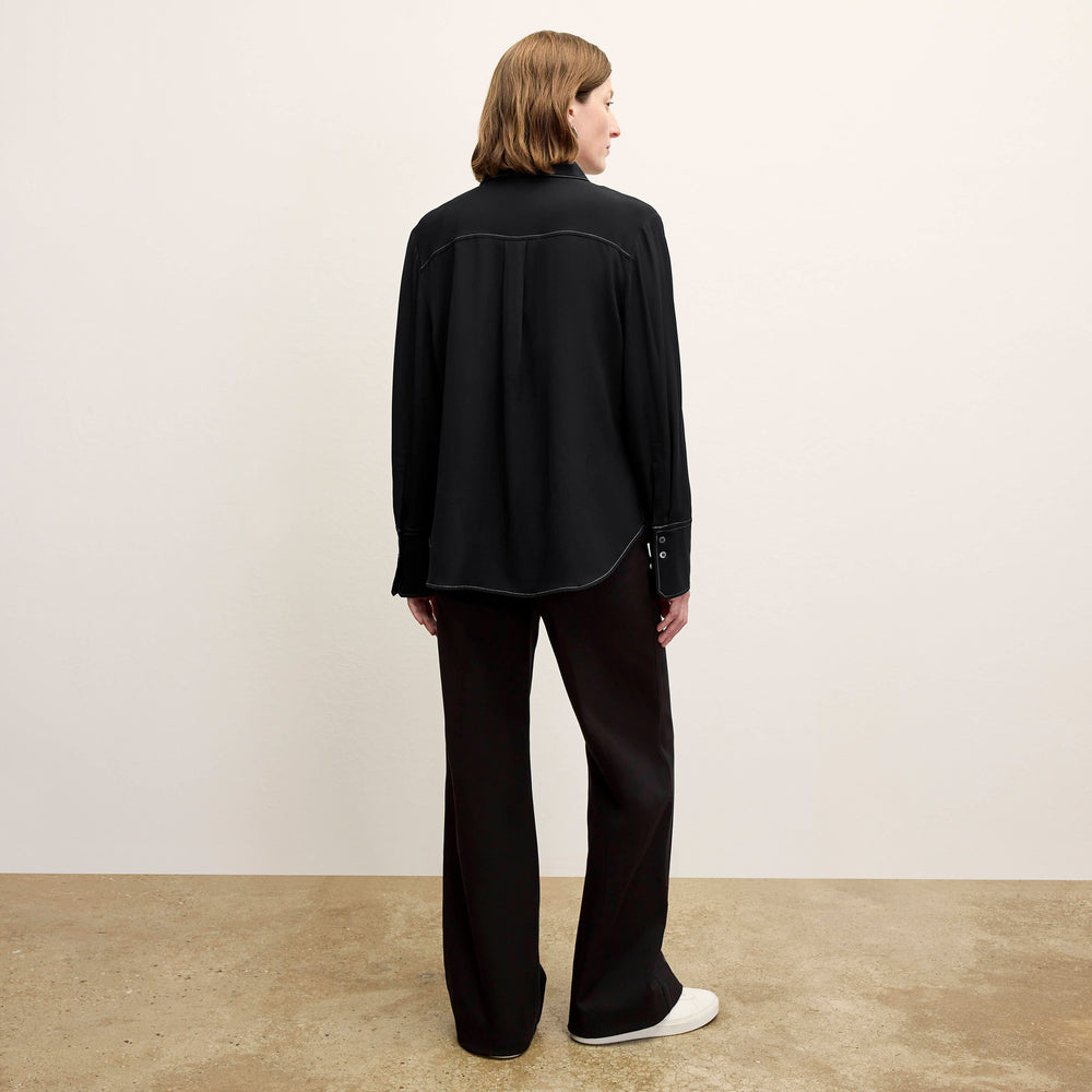 back image of a woman wearing the mira top in black