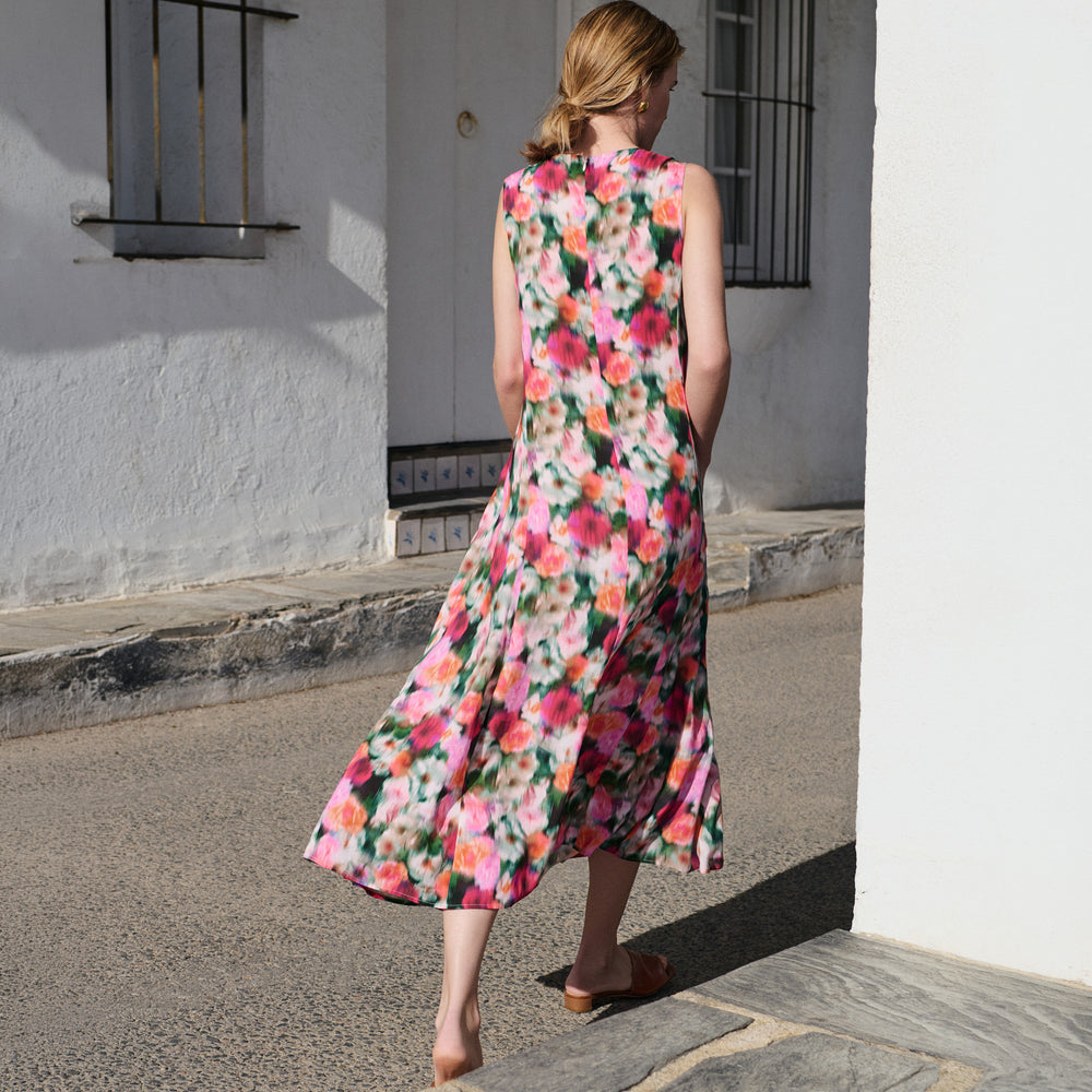 Back of woman in floral print dress.