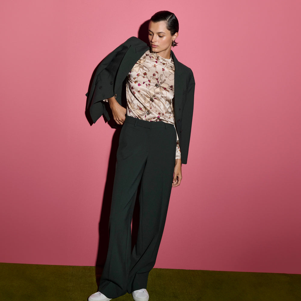 front image of a woman wearing the sohee top in botanical print