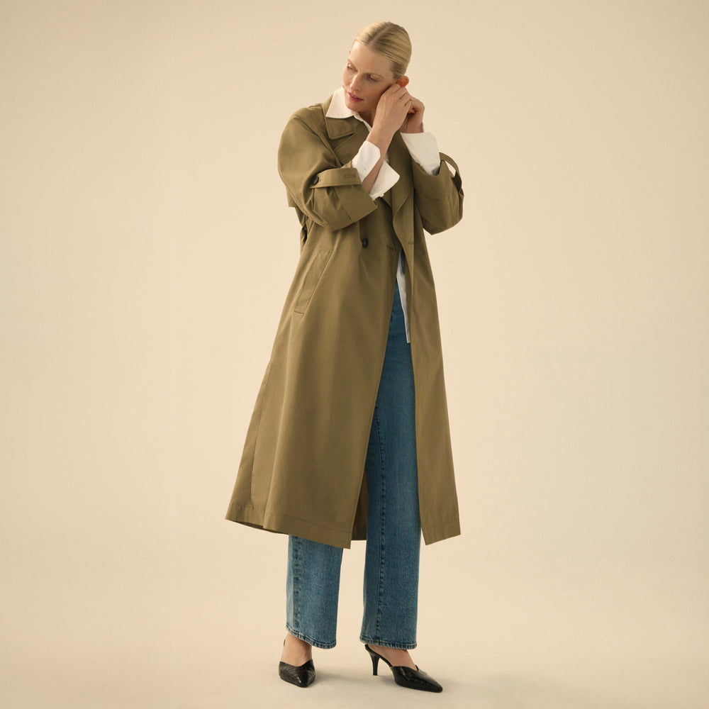front image of a woman wearing the curtis trench