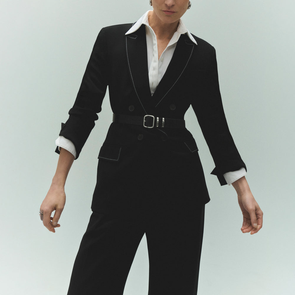 front image of a woman wearing the filomina top in white