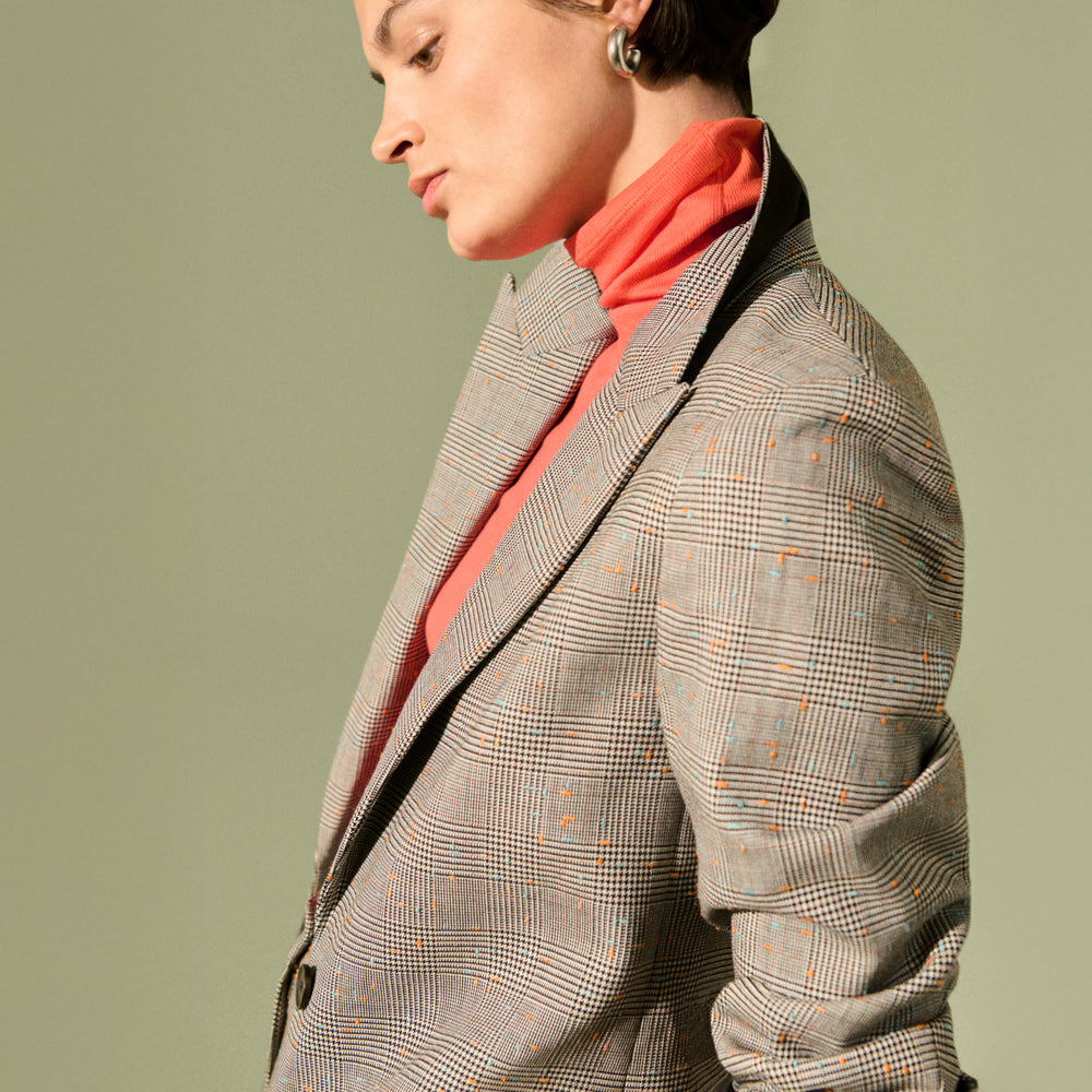 side detail image of a woman wearing the Tyner Blazer in Sharkskin in Mixed Check