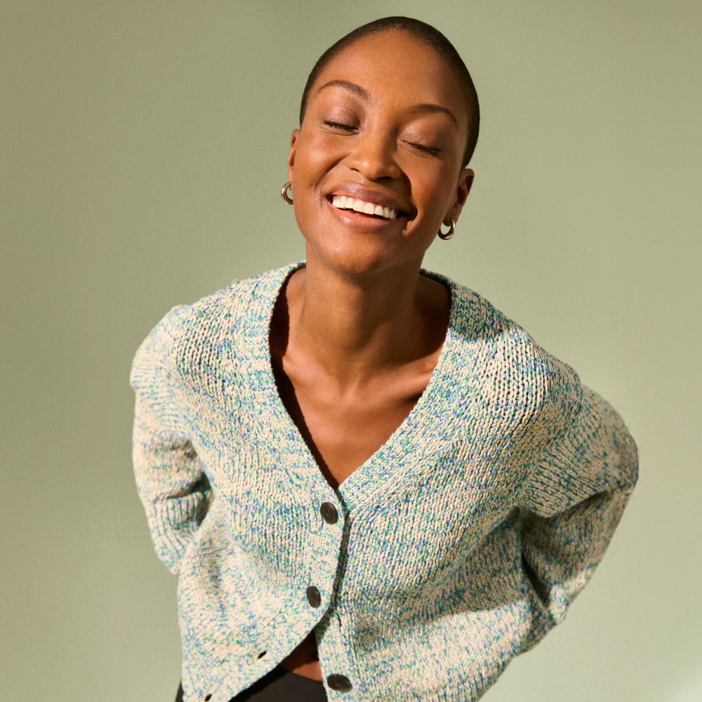 front image of a woman wearing the dakota sweater in multi