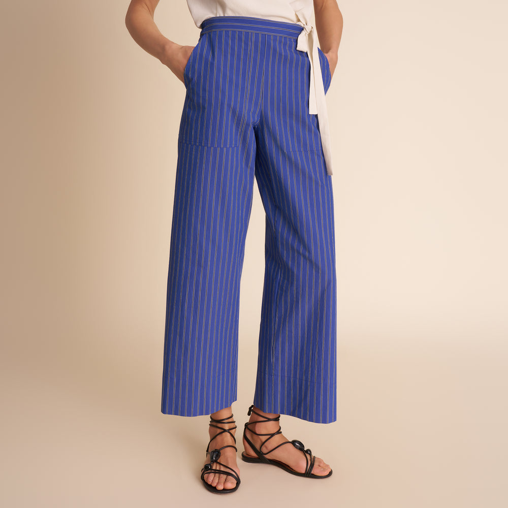 woman in blue stripped pants.