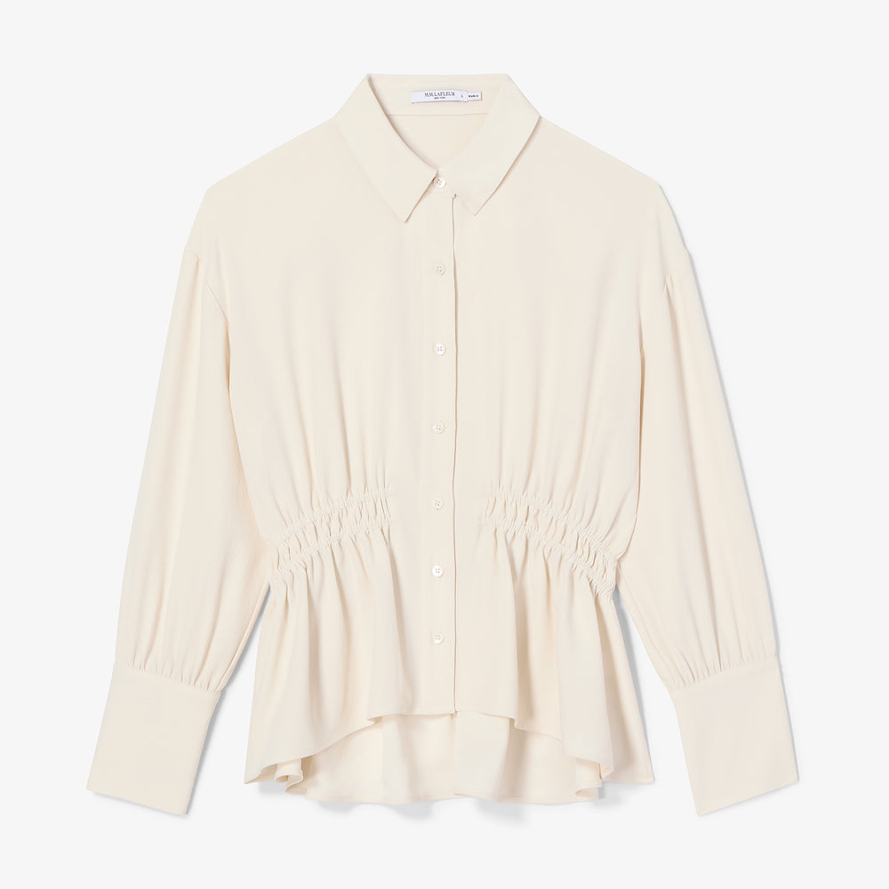 Beige blouse on a white background