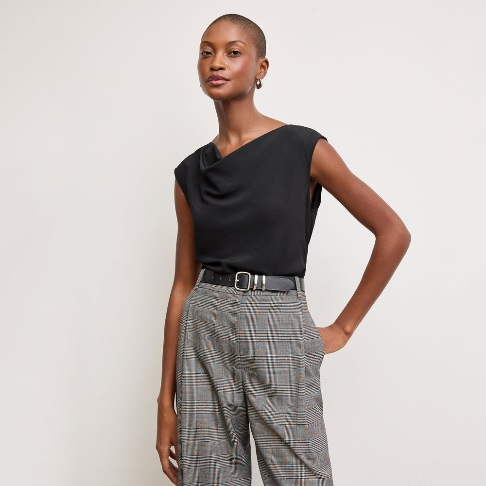 Front image of a woman wearing the Nora Top in Black