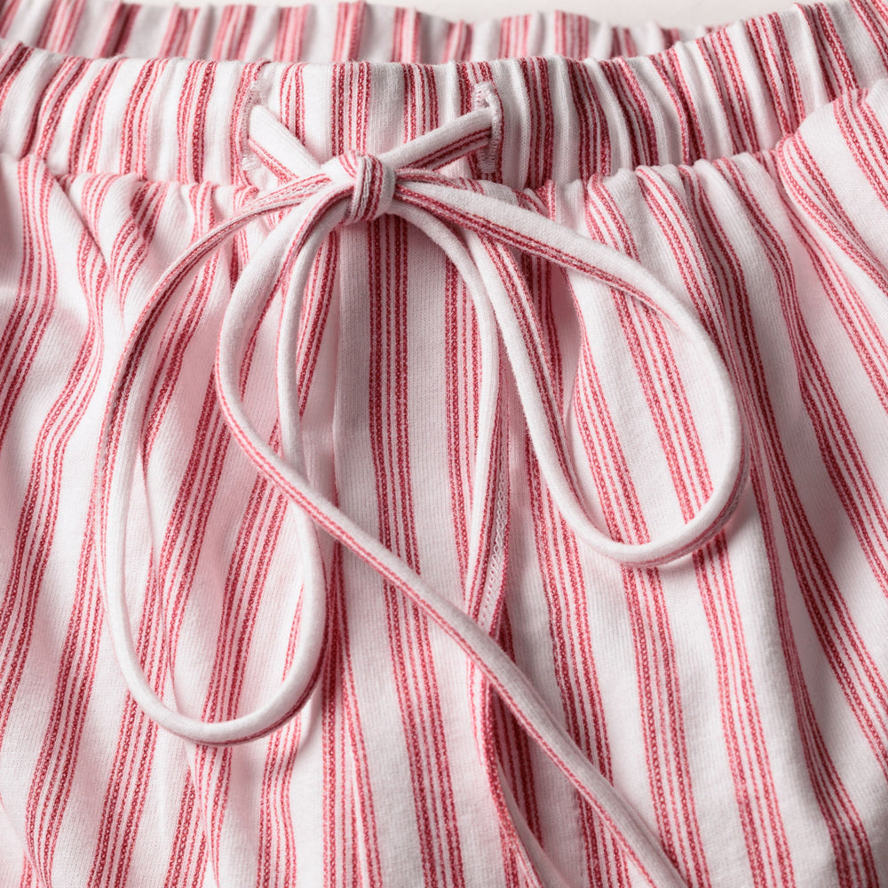 Red and white striped pants with a drawstring on a white background