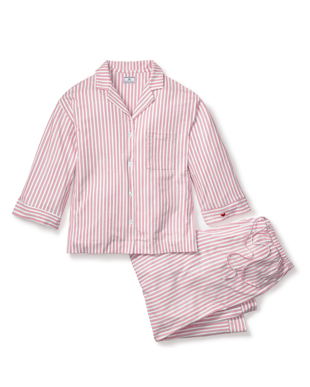 Pink and white striped pajama set on a white background