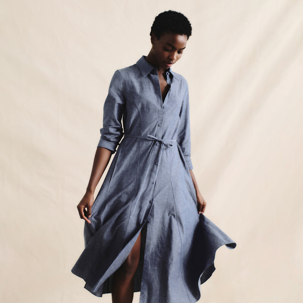 front image of a woman wearing the pepper dress in clear blue