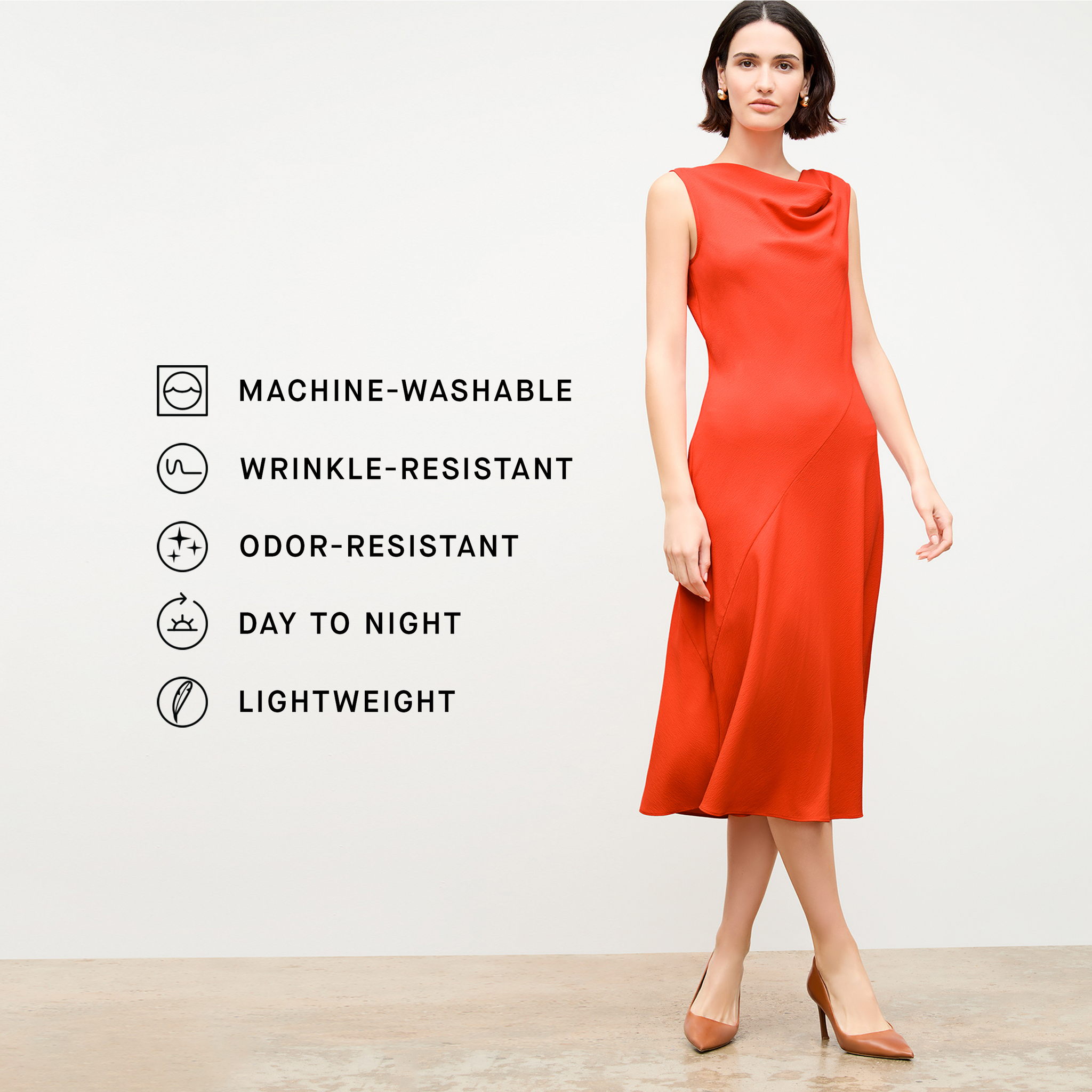 front image of a woman wearing the priya dress in bright coral 