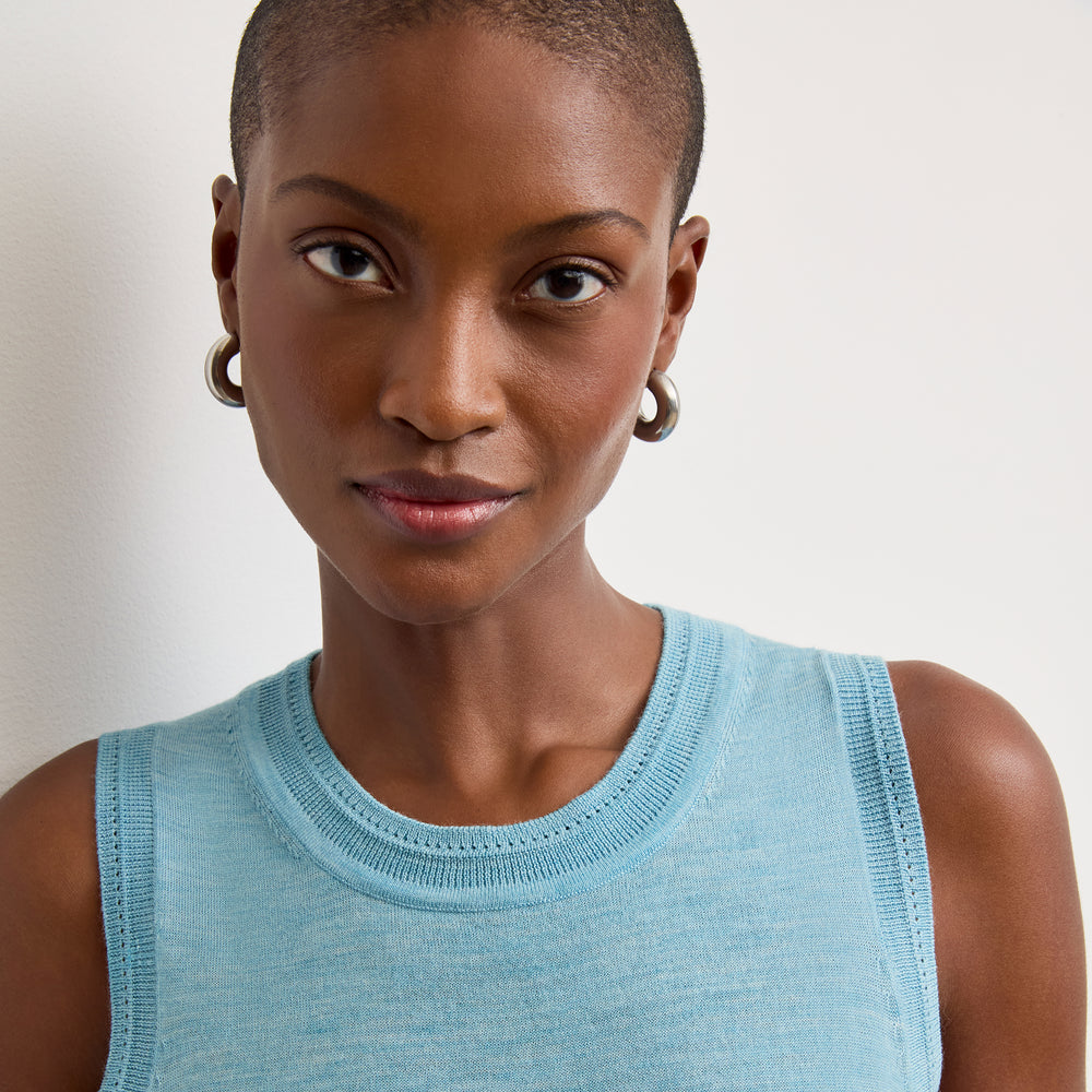 front image of a woman wearing the jamie tank in morning sky