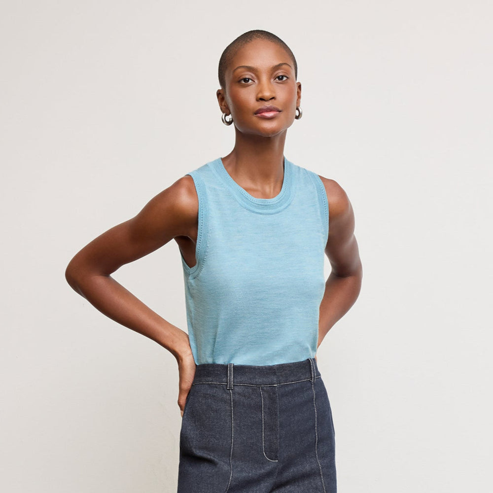 front image of a woman wearing the jamie tank in morning sky