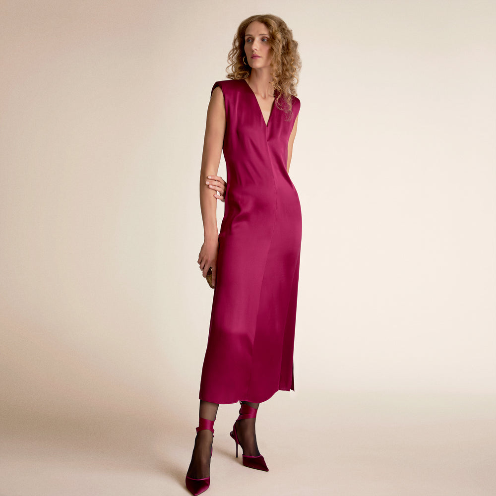 Woman wearing a dark fuchsia dress