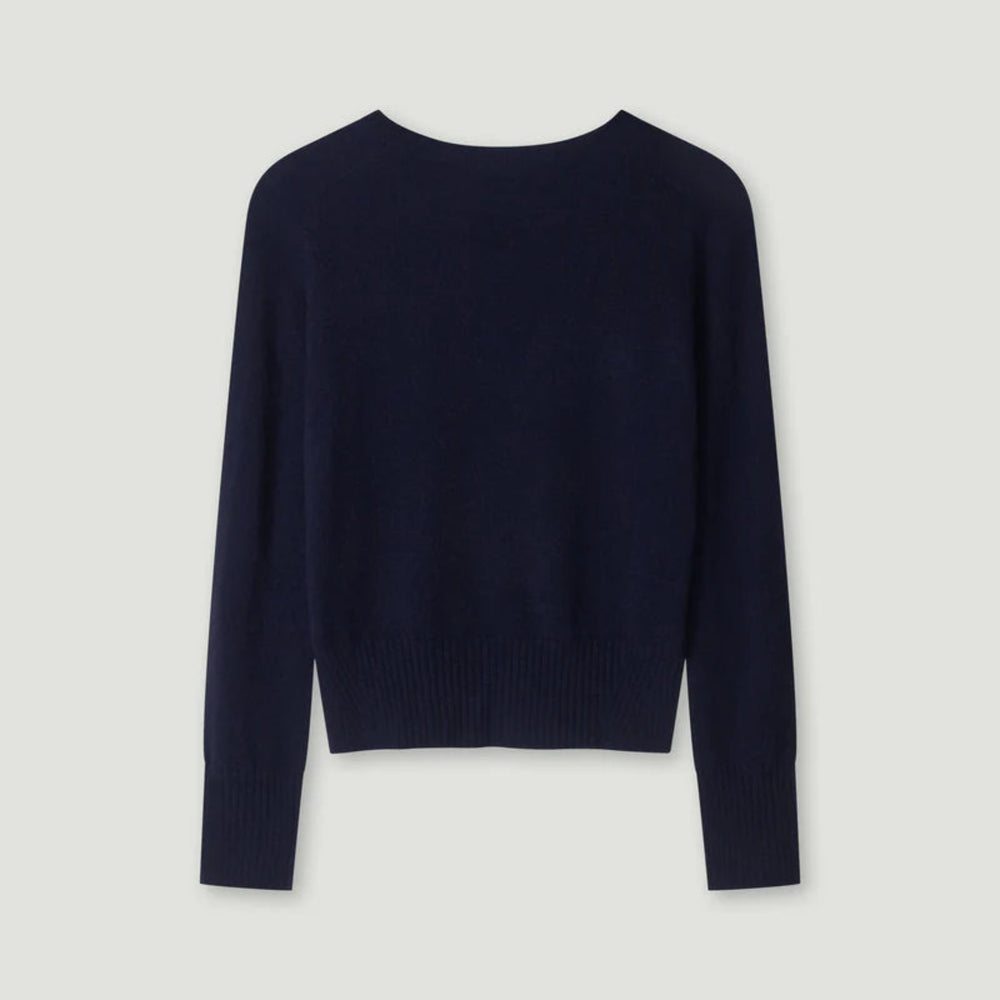 Navy blue sweater on a light gray background