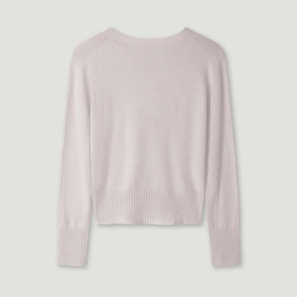 Light pink sweater on a light gray background
