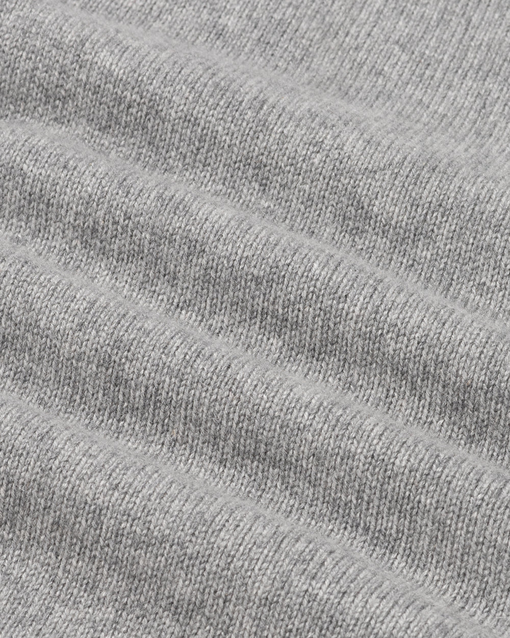 Close-up of gray textured fabric with horizontal lines.