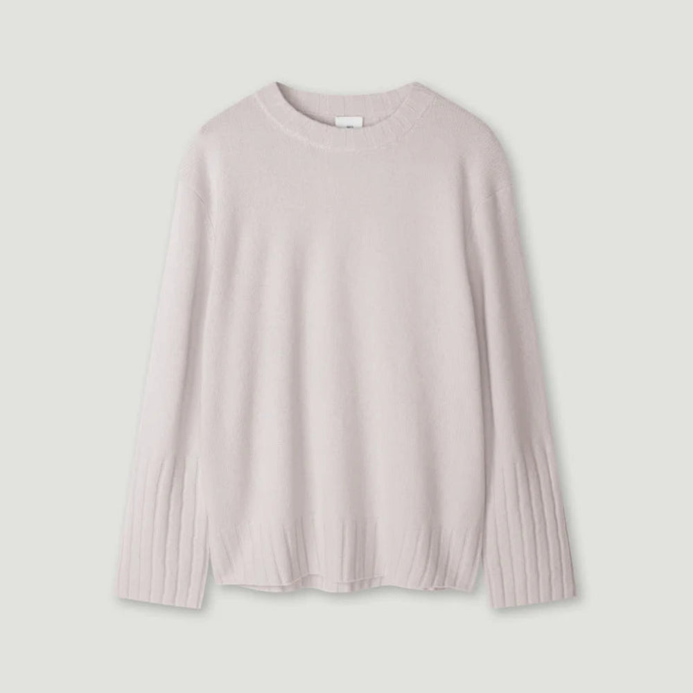 Light pink sweater on a light gray background
