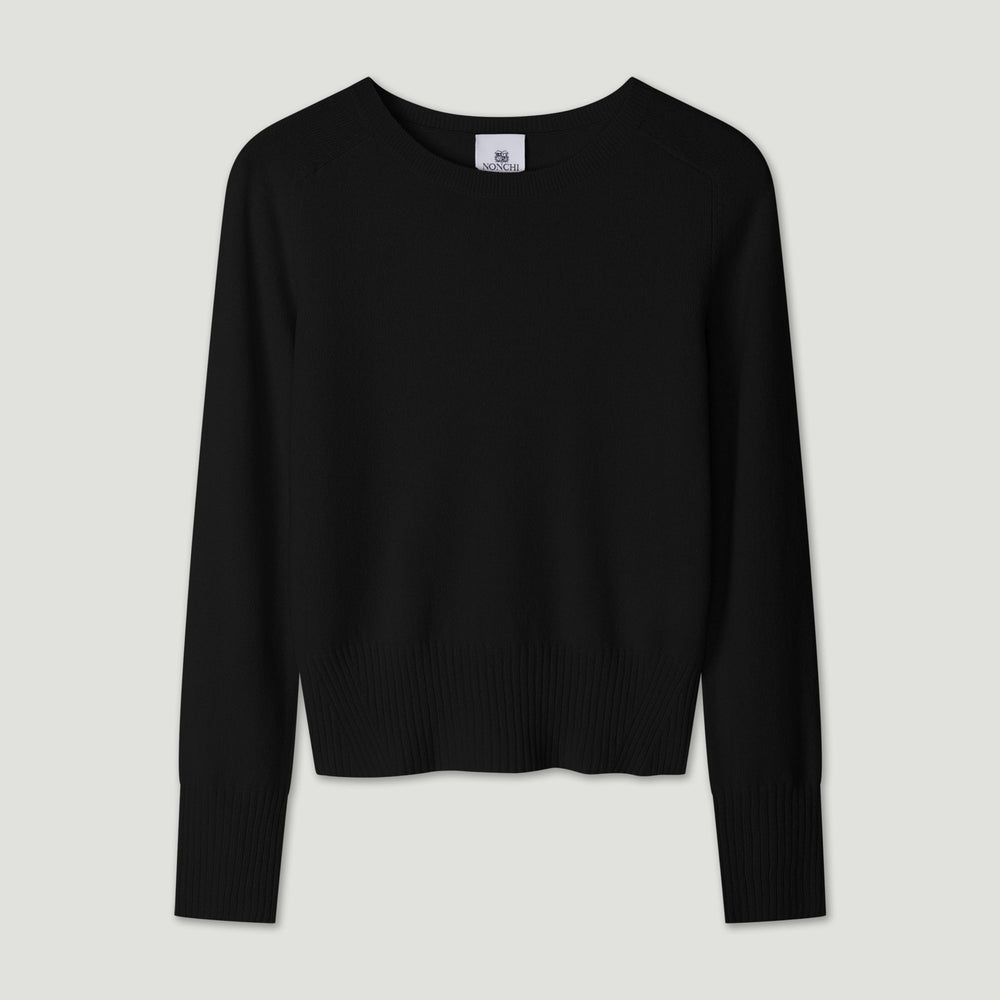 Black sweater on a light gray background