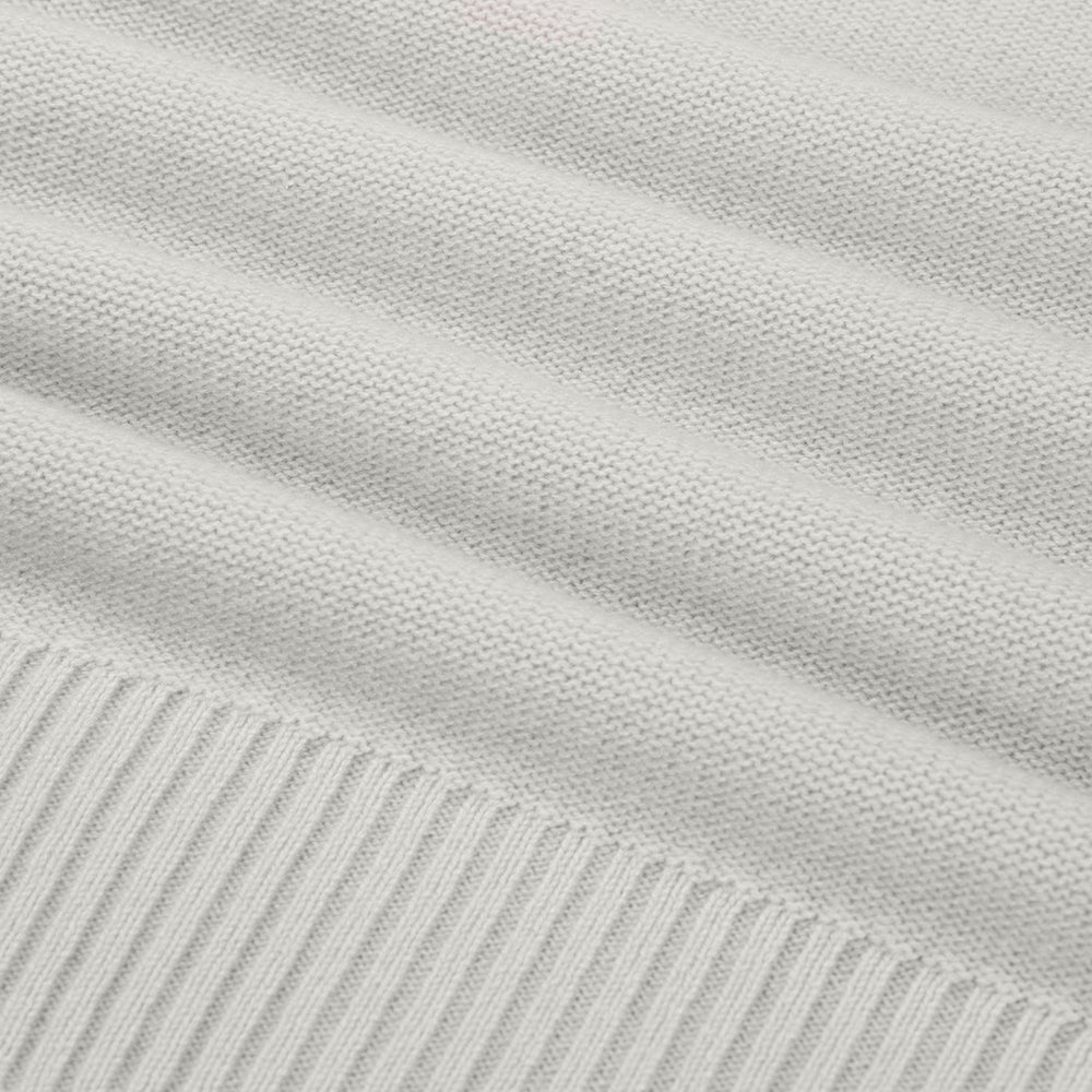 Close-up of light gray fabric with subtle texture and stripes.