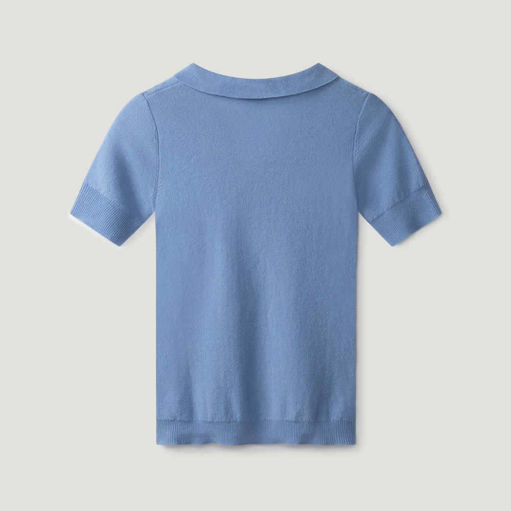 Blue polo shirt on a light gray background.