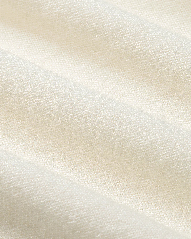 Close-up of a textured beige fabric surface