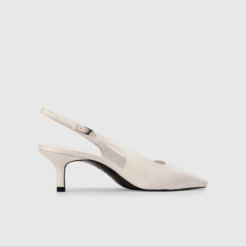 White slingback shoe on a light gray background