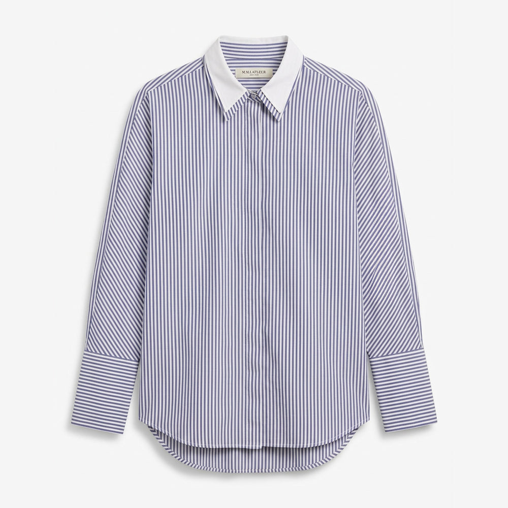 A long-sleeve button-up shirt with vertical blue and white stripes, featuring a solid white pointed collar and buttoned cuffs, shown against a light gray background.