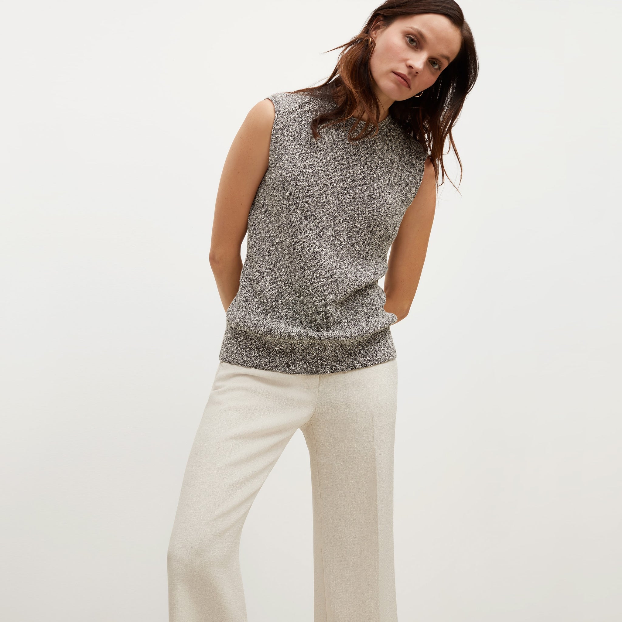 Front image of a woman standing wearing the Barbara Sweater—Knit Boucle in Black / White 