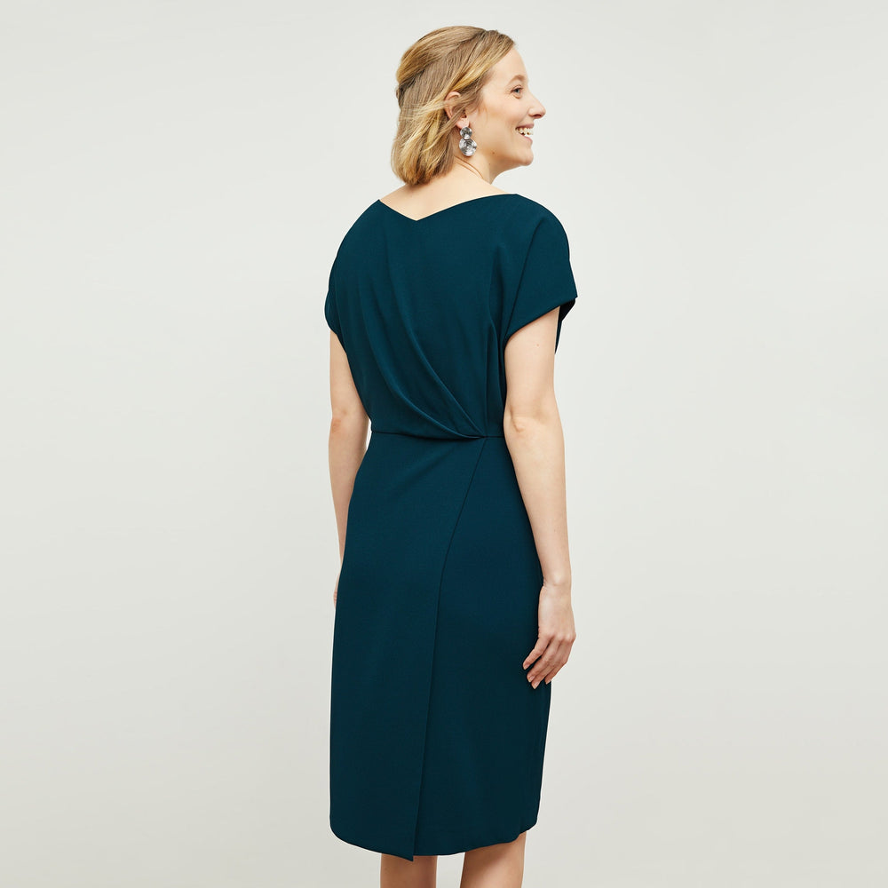 Back image of a woman standing wearing the Jillian Dress in Rainforest