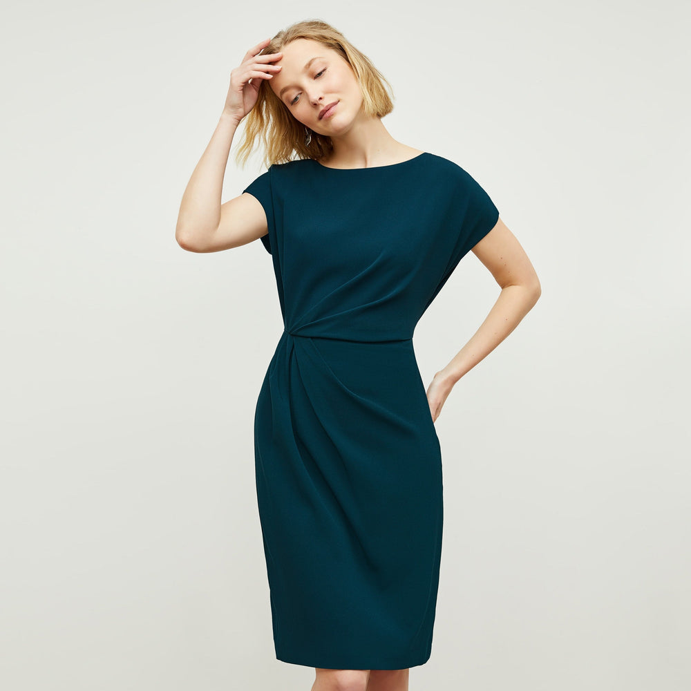 Front image of a woman standing wearing the Jillian Dress in Rainforest