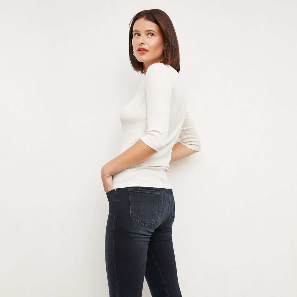 Side image of a woman wearing the Soyoung top in Ivory