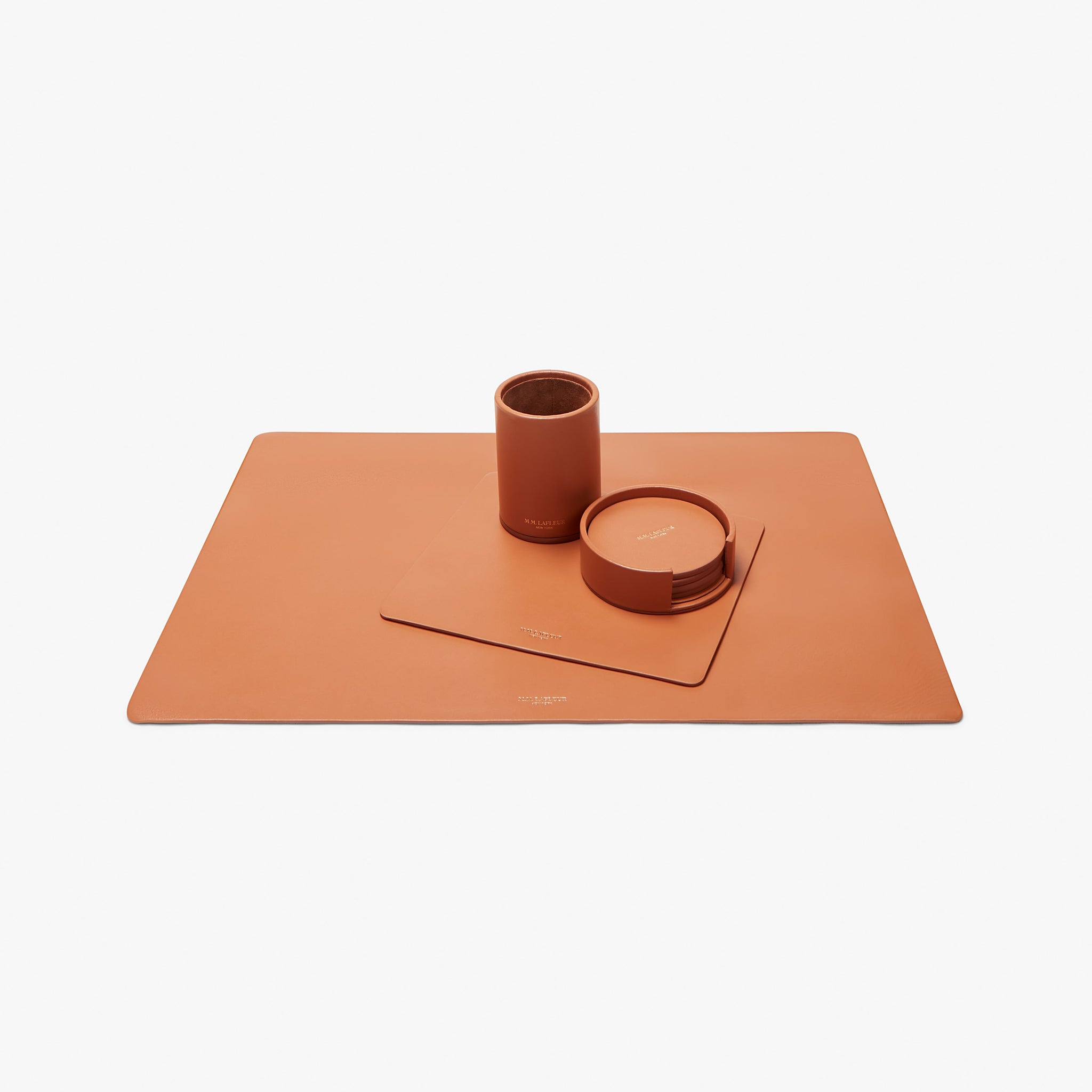 Desk blotter and leather desk set in caramel. 