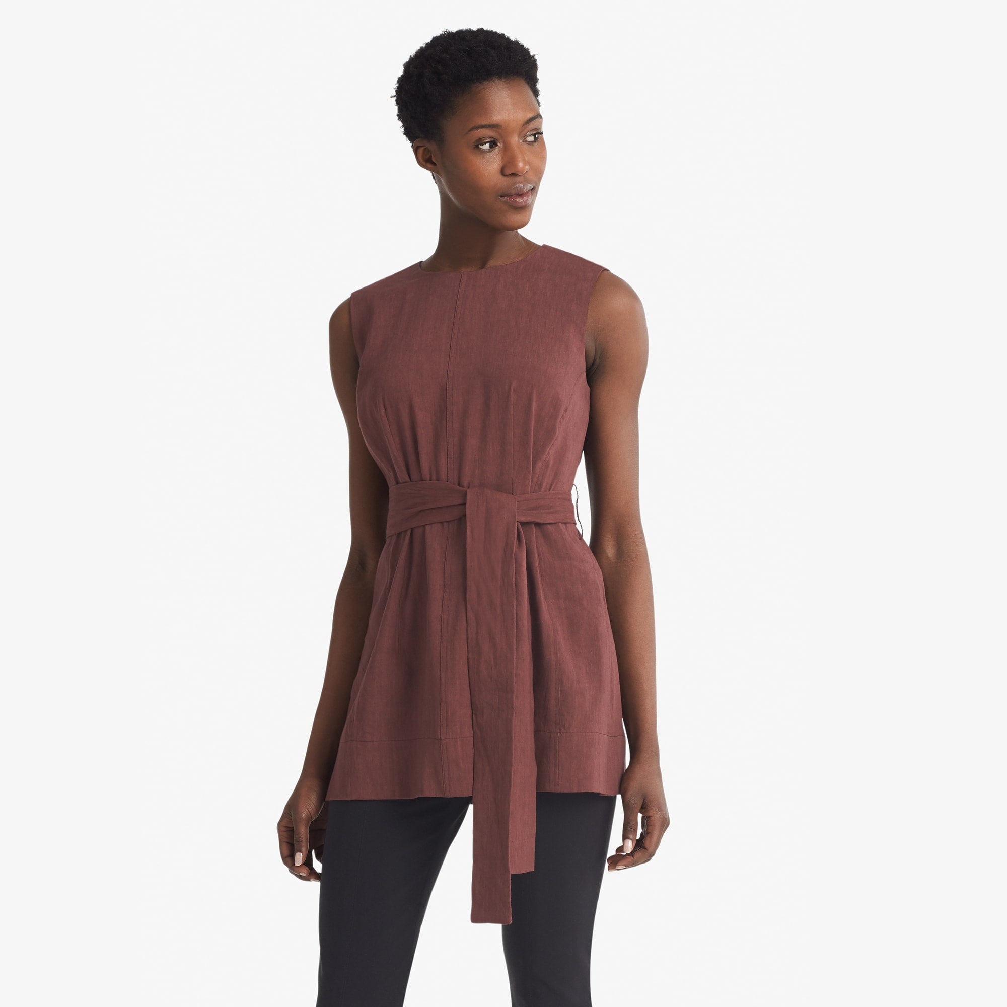 Front image of a woman standing wearing the Angelina top stretch linen in sumac 