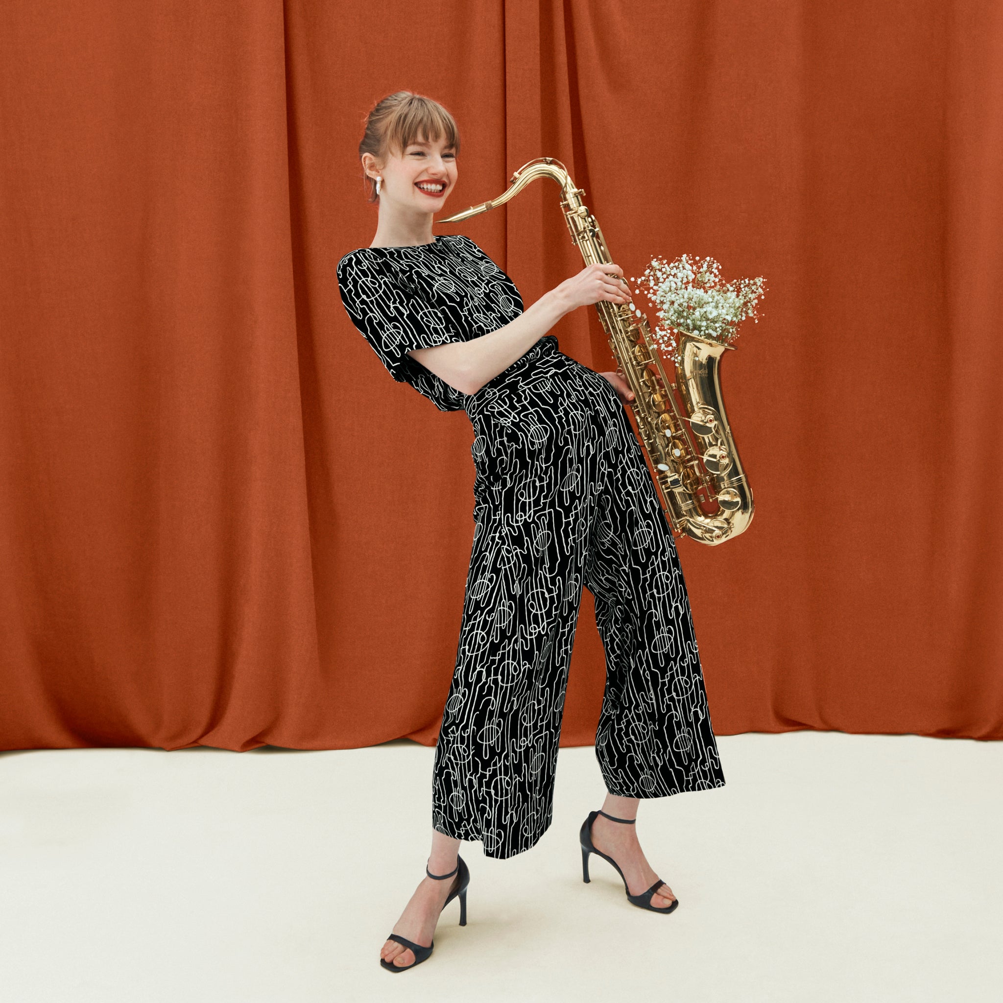 front image of a woman wearing the zhou pant in symphony print