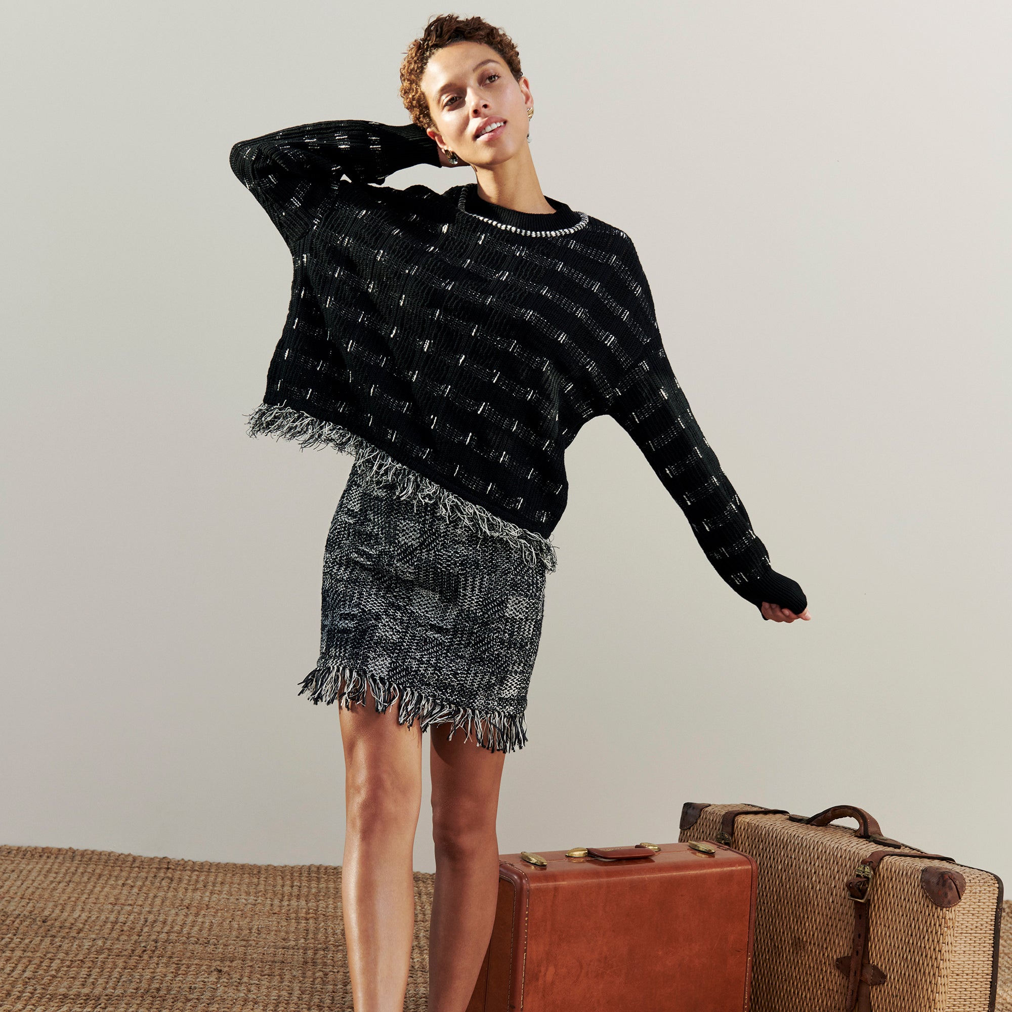 Front image of a woman wearing the Figari Pullover - Linear Interweave in Black / White