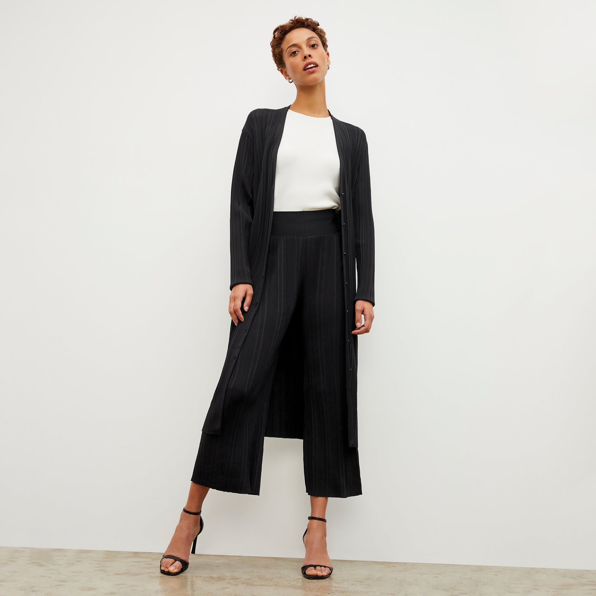 Front image of a woman wearing the Marijane Pant - Textured Knit in Black
